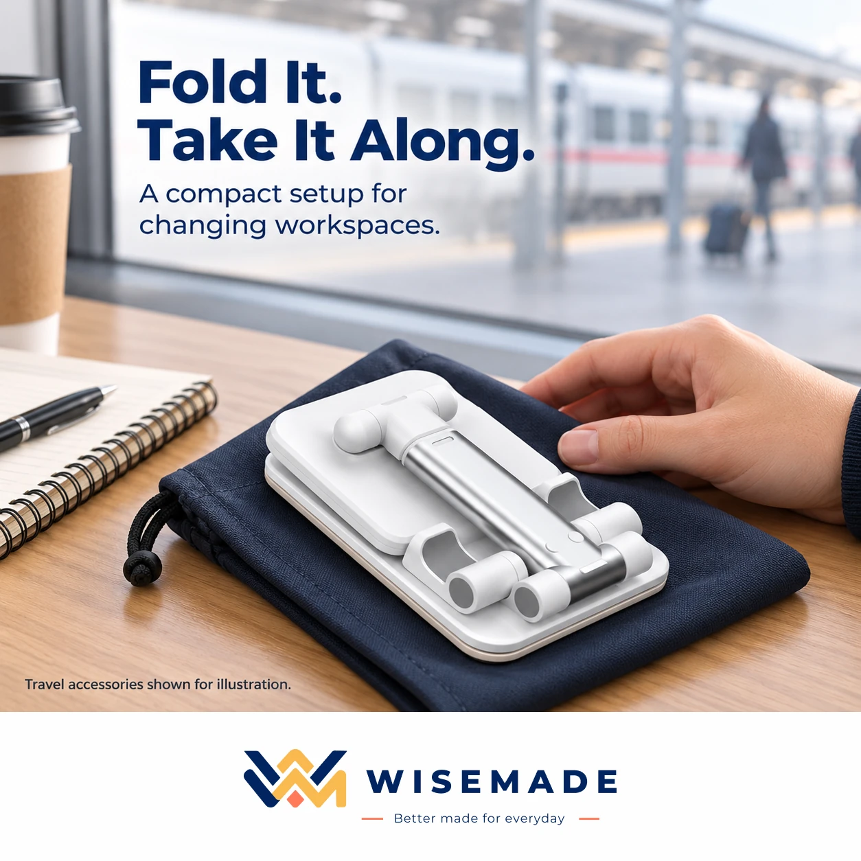 White foldable phone holder folded flat on a travel pouch on a café table